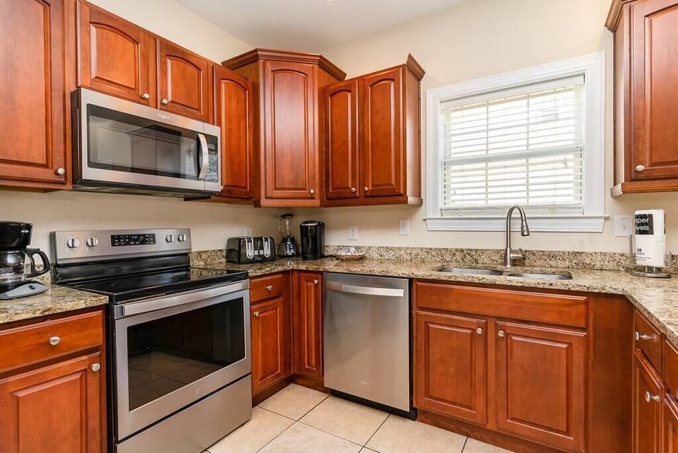 Fully equipped kitchen including stainless steel appliances on ground floor