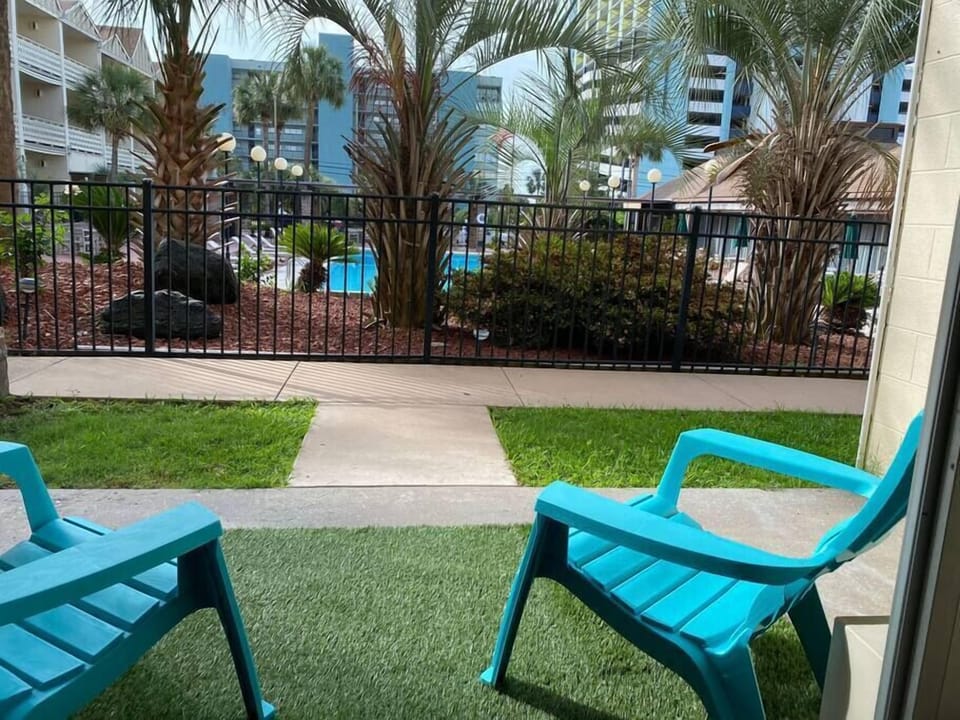 Outdoor seating with view of pool