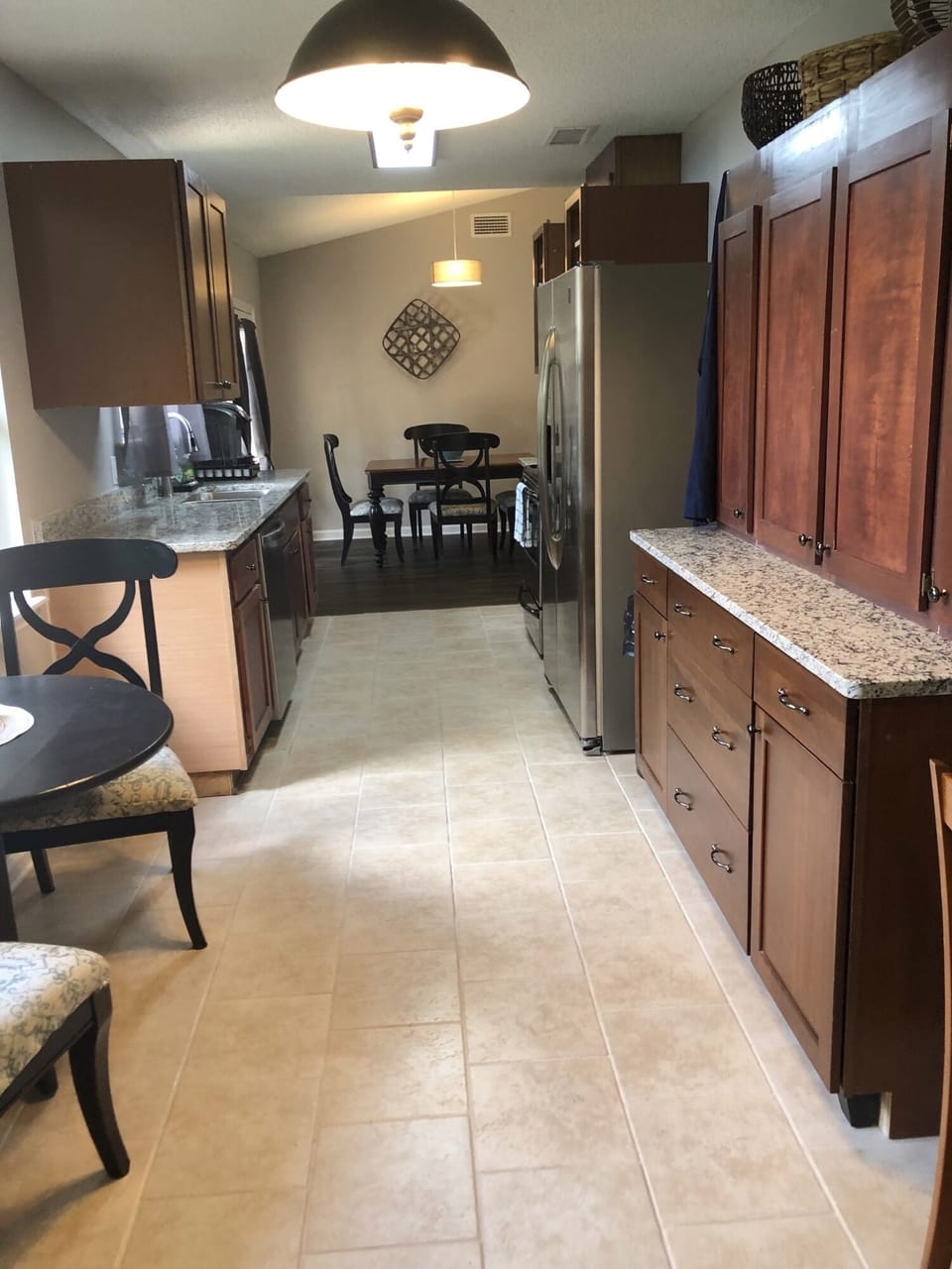 Kitchen view showing galley way through to dining table.