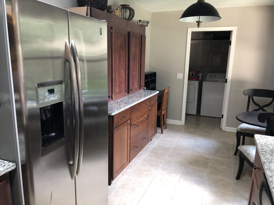 Galley Kitchen showing the Refrigerator,  built-in buffet, desk & breakfast area