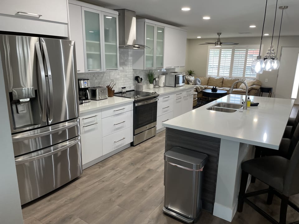 Big Open Kitchen into Family room and Billiard Room