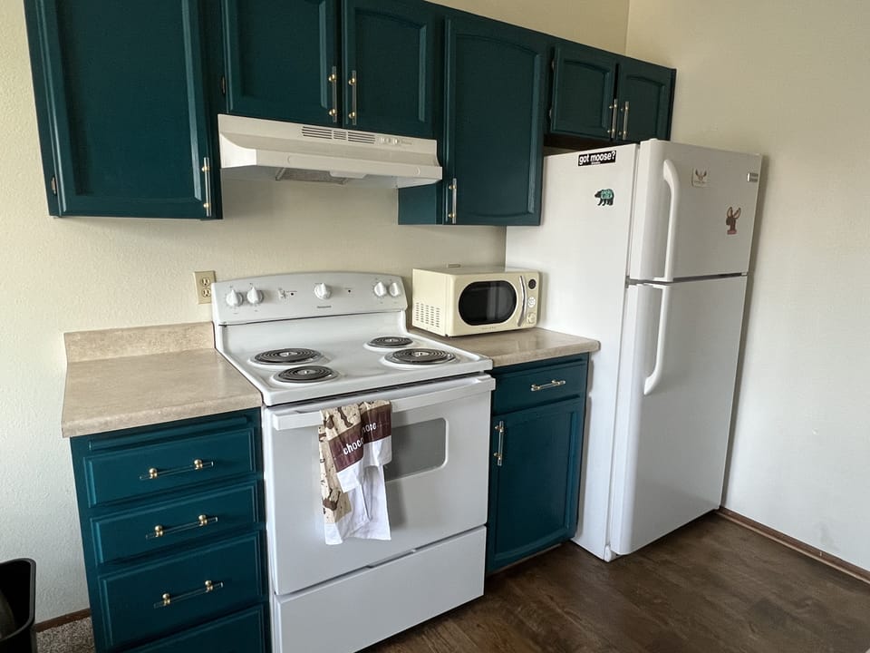Pots and pans, utensils, coffee maker, blender, cooking utensils, wine glasses 