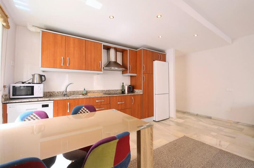 Another view of the modern kitchen with dining area