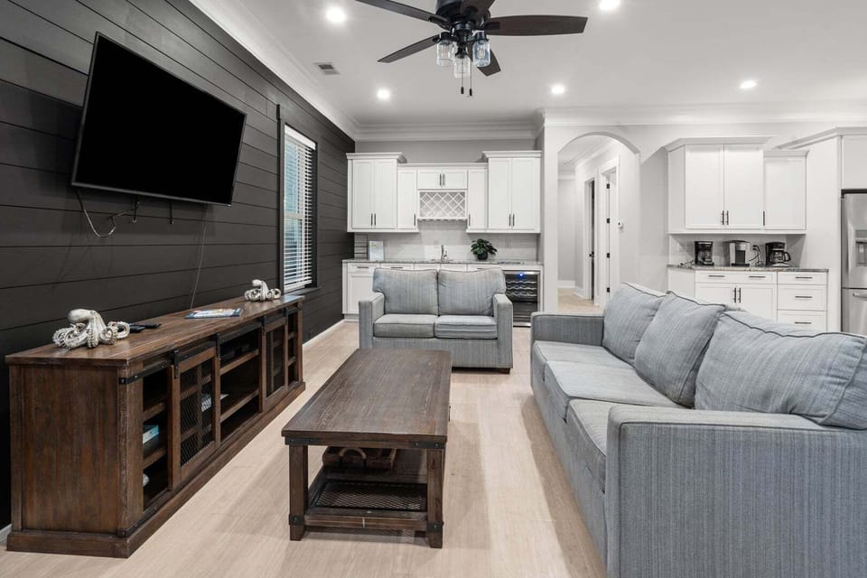 Open living area flowing into the kitchen at Oceanside Charm, a Cherry Grove getaway in North Myrtle Beach