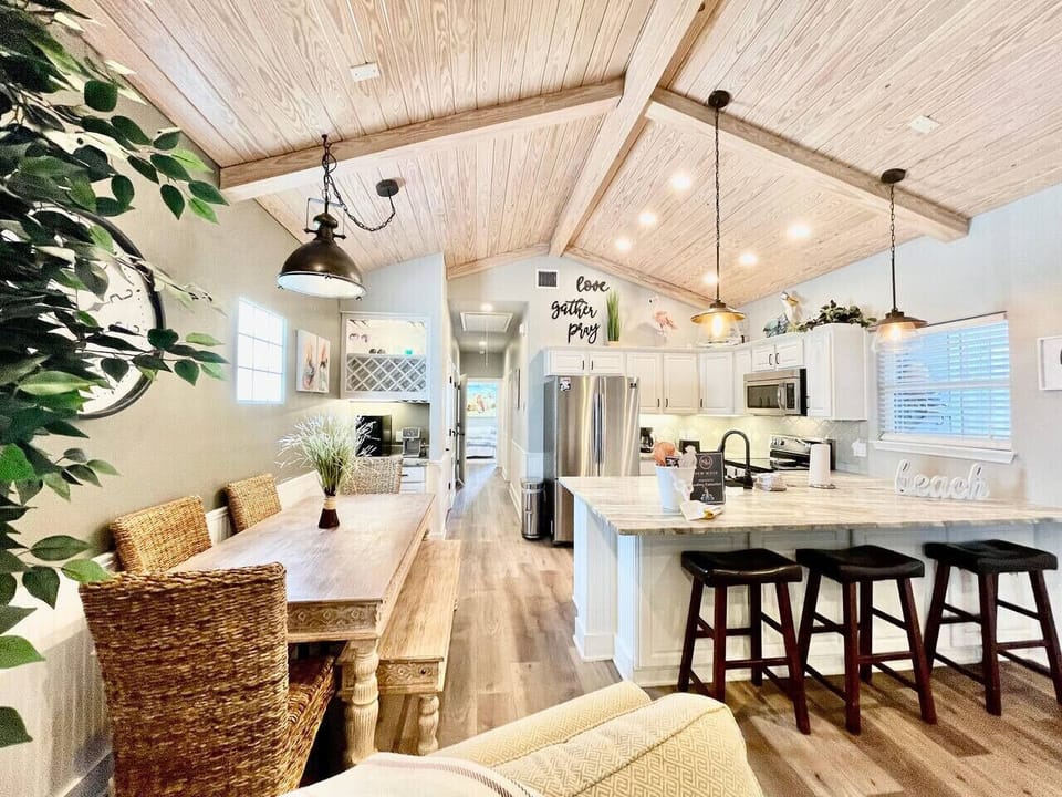 🌴 Coastal charm meets comfort — dine, relax, and gather in this breezy open-concept space.