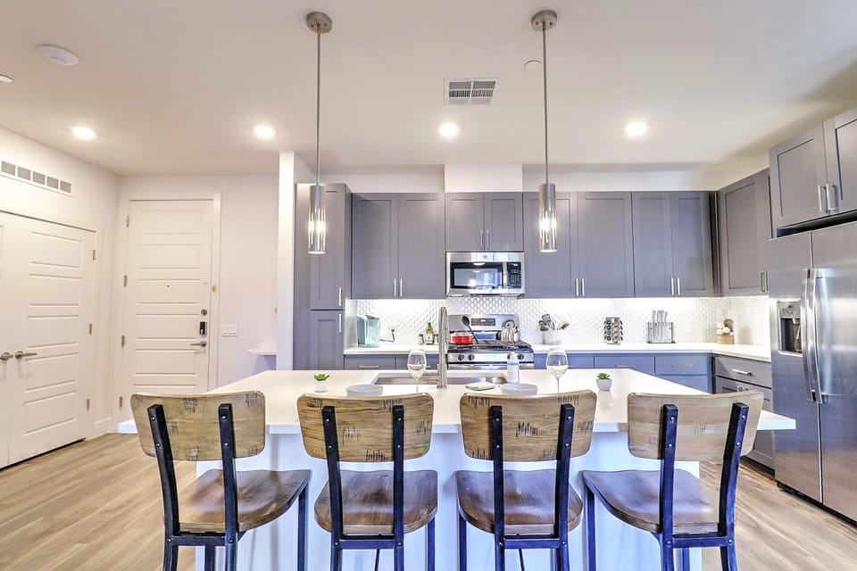 Whip up meals in the modern kitchen, fully stocked with appliances, cookware, and essentials for everyday cooking.