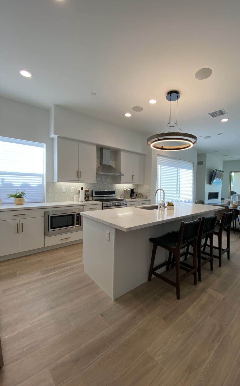 Kitchen with quartz countertops custom cabinets and stainless appliances