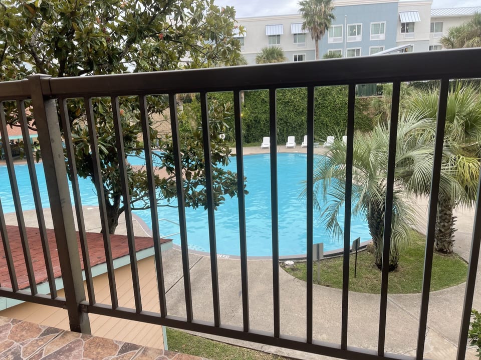 Balcony looking over resort size pool