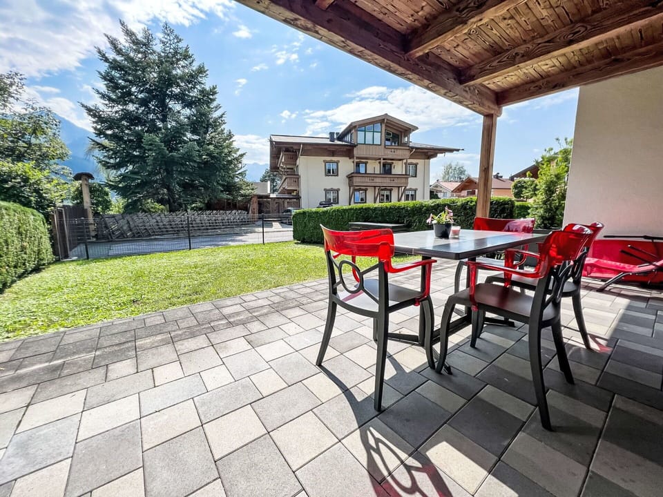 Plant, Sky, Building, Property, Furniture, Cloud, Table, Chair, Tree, Outdoor Table
