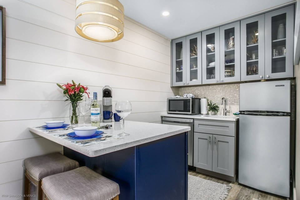 Beautiful, modern kitchenette with a stainless dishwasher, a microwave, refrigerator and basic essentials included