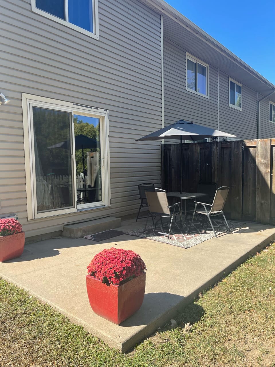 Enjoy a cool drink on the patio with fenced yard. 