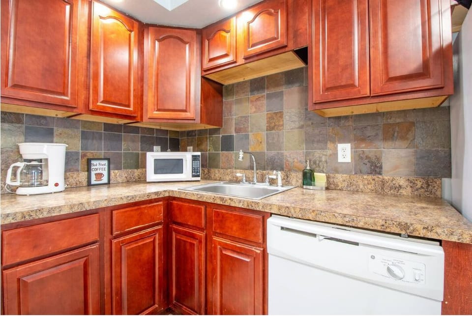 Kitchen with dark wood cabinets and sink