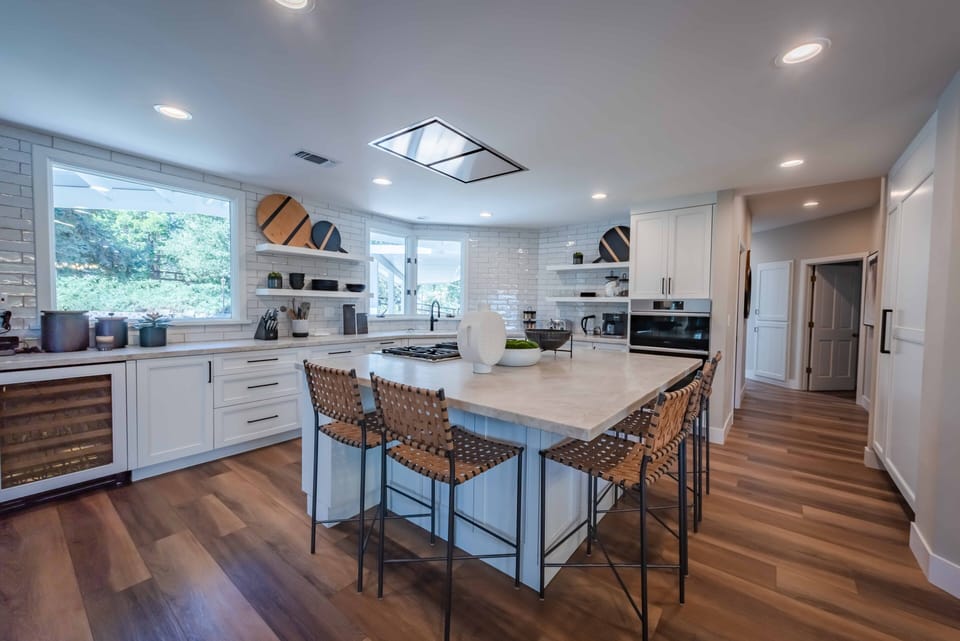 Barstools surround the kitchen island