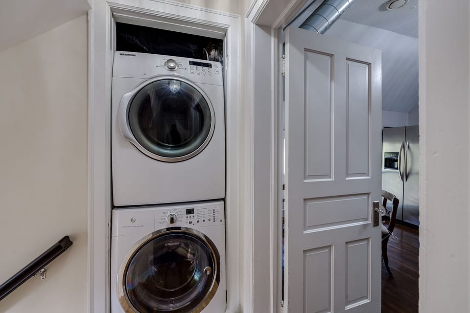 Laundry room off of second floor kitchen