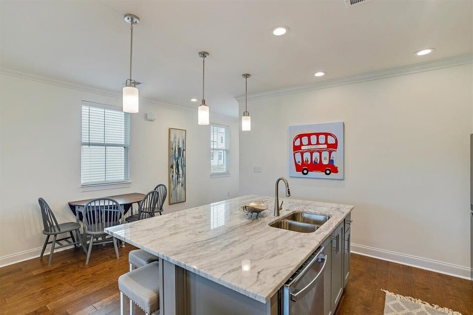 6 barstools line the island for easy meals. The drop leaf dining table seats 4.