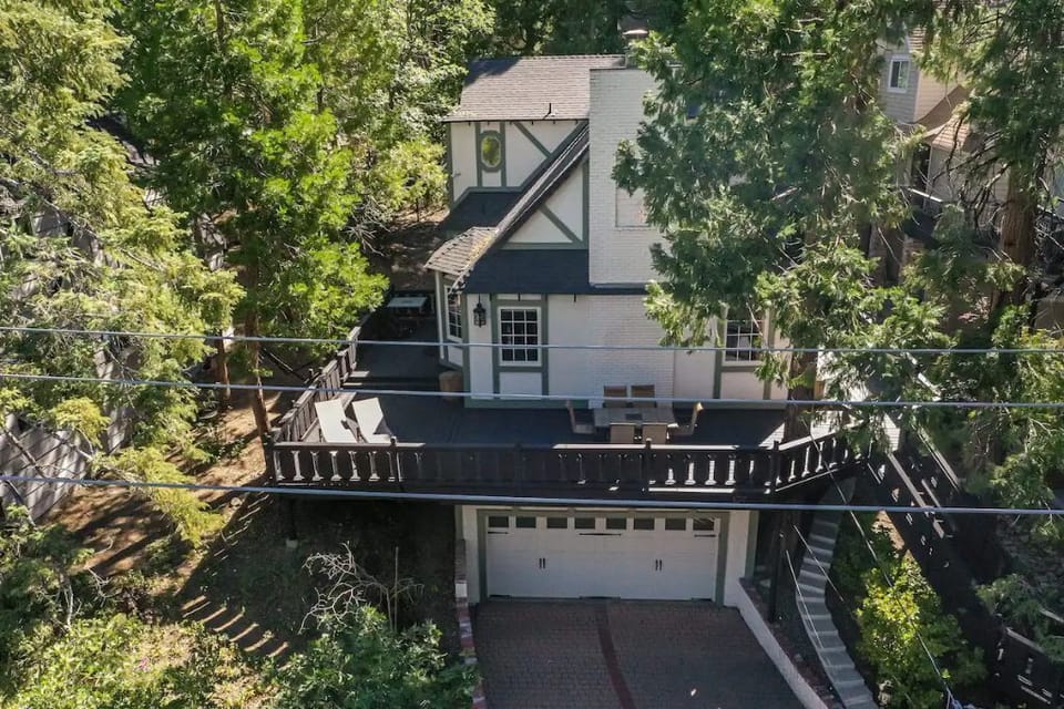 Drone view of house and wrap around deck