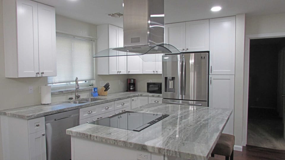 Large kitchen with views of the pool and backyard