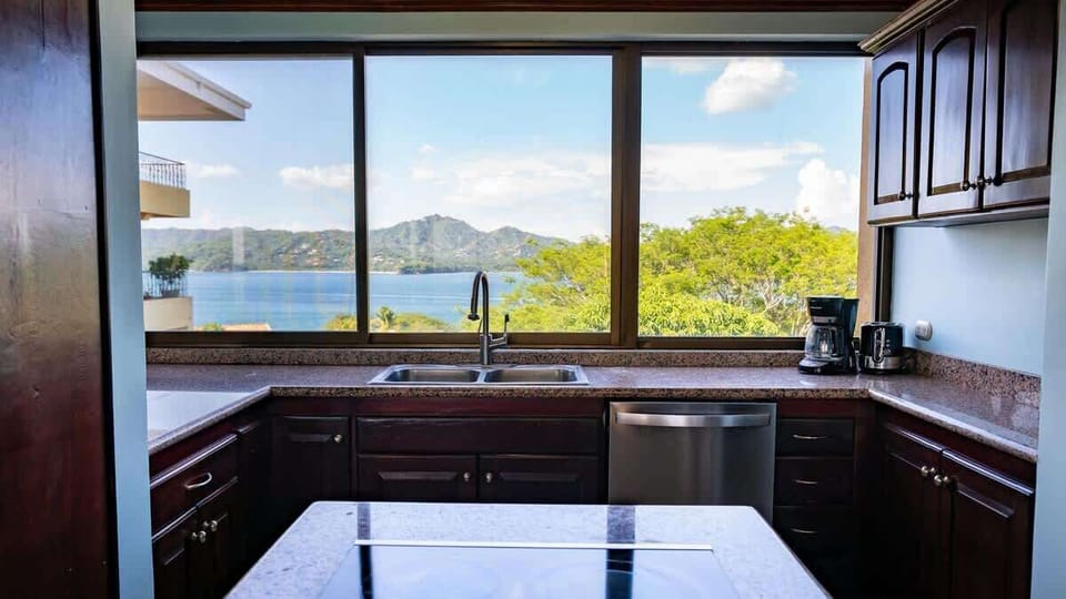 Open kitchen, stainless steel appliances, ocean views
