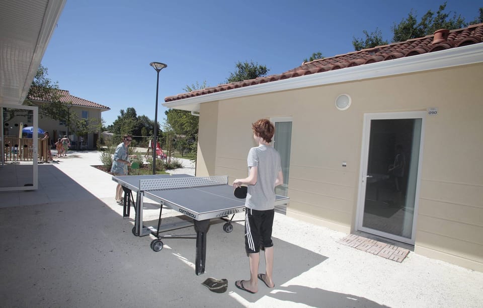 Share laughs at the shared ping-pong table.