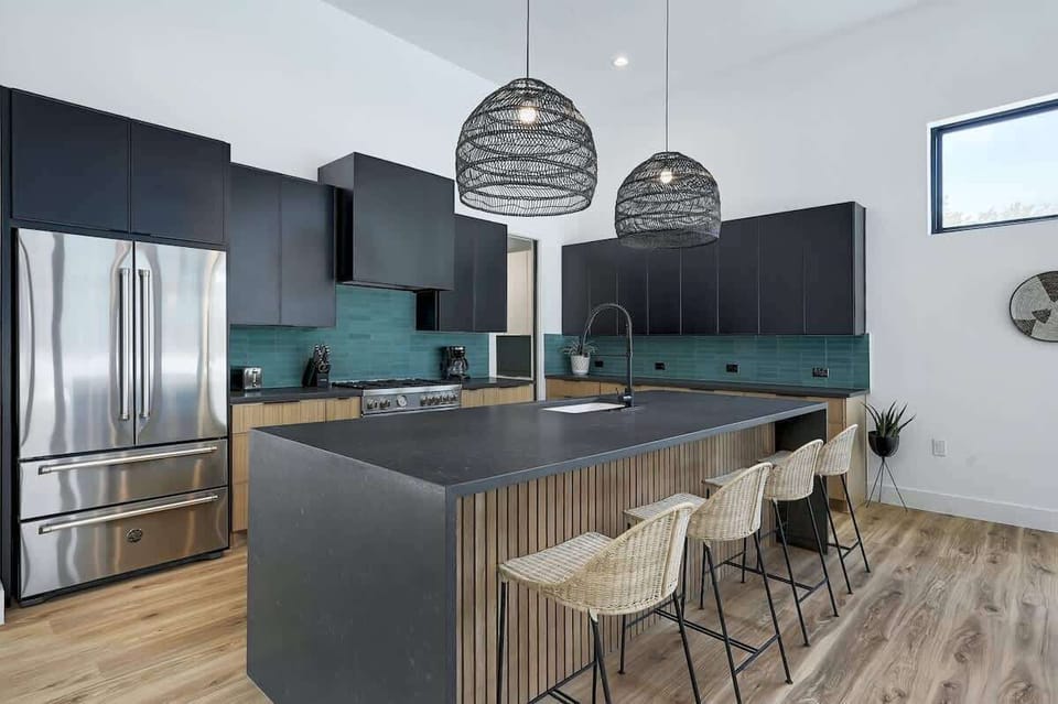 There is seating for 4 at the breakfast bar and seating for 8 at the dining table