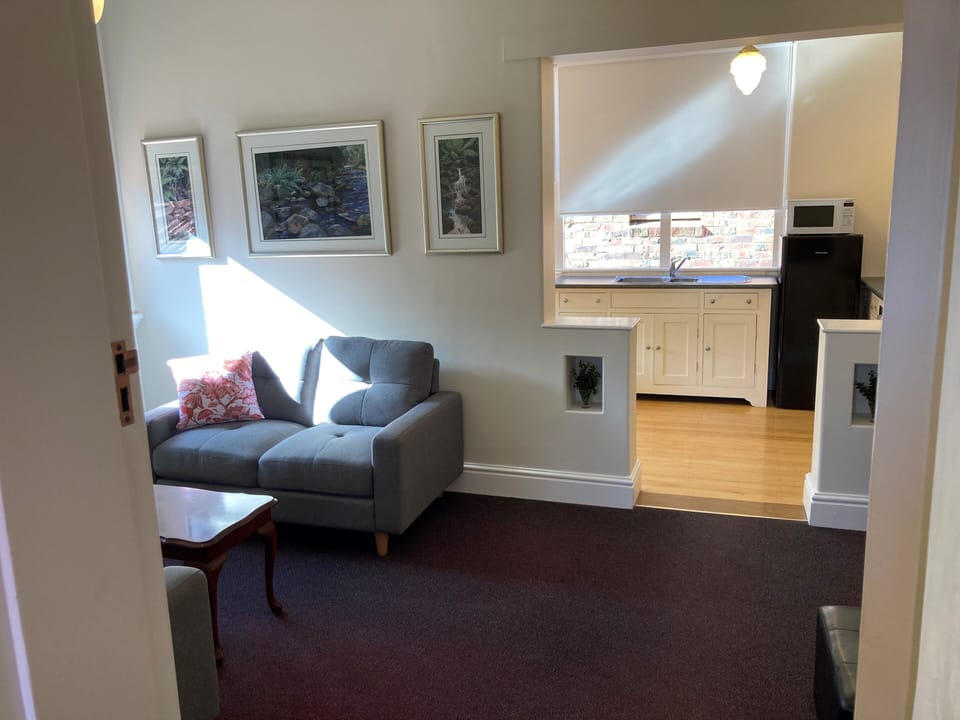 Living room with entry to kitchen