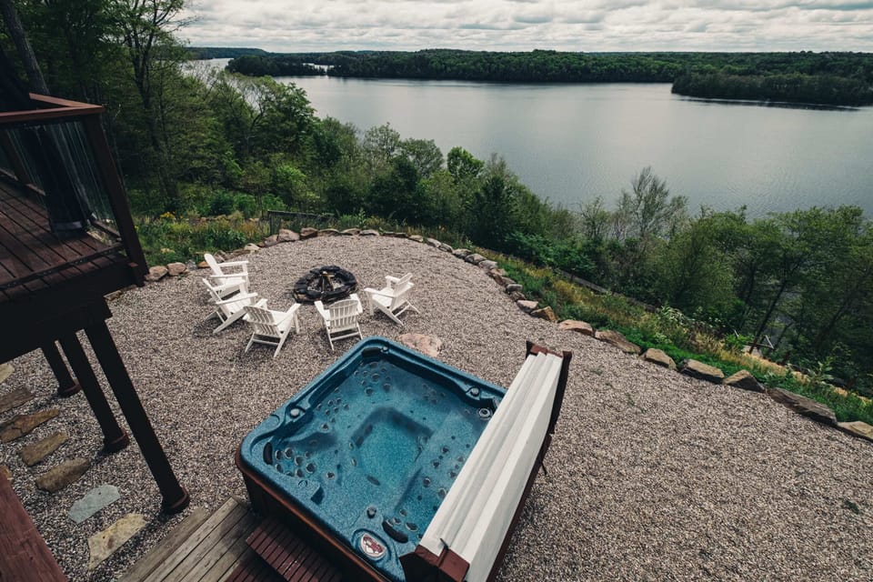Hot tub, fire pit and the beautiful view of Wolfe Lake.