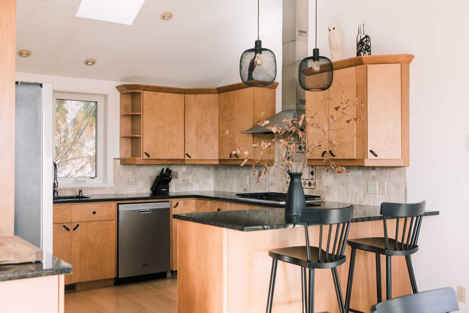 The kitchen features a breakfast bar so you can always keep those cooking company.