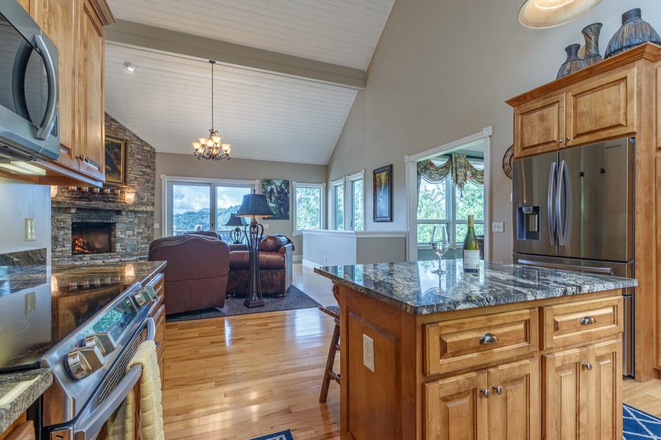 View of Lake Glenville and the mountains to be seen through the open floorplan