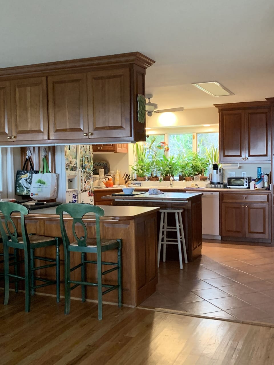 No "being stuck in the kitchen"! This airy space has views of ocean and trees.