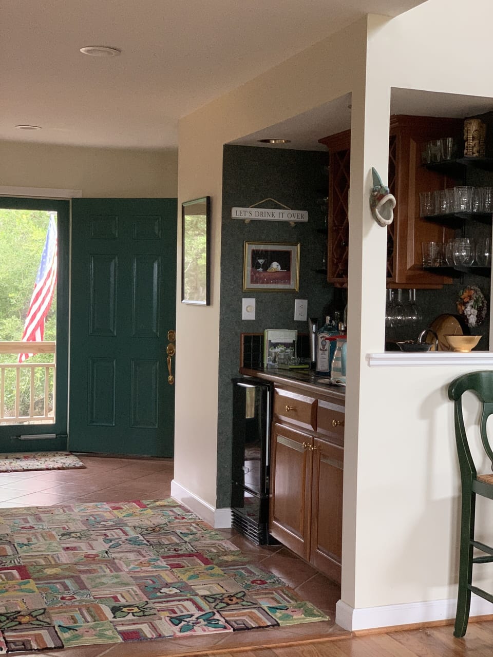 Welcoming Wet Bar with under-counter ice-maker and wine rack.