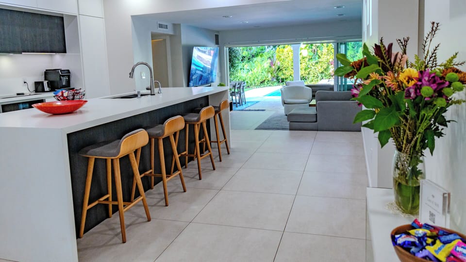 Enter through the front door and see all the way through to the patio & pool