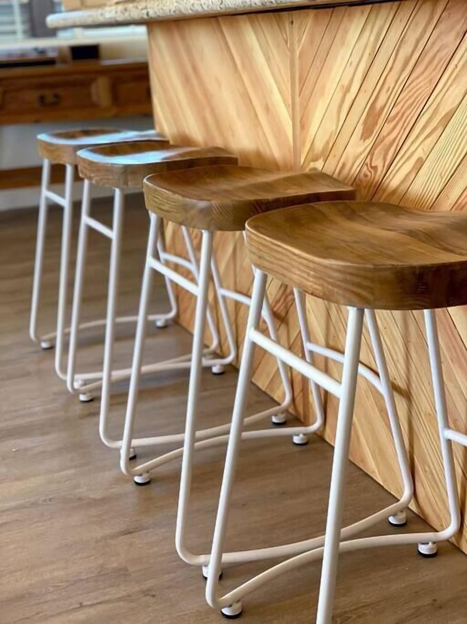Stools and the custom chevron pattern piece on the kitchen island