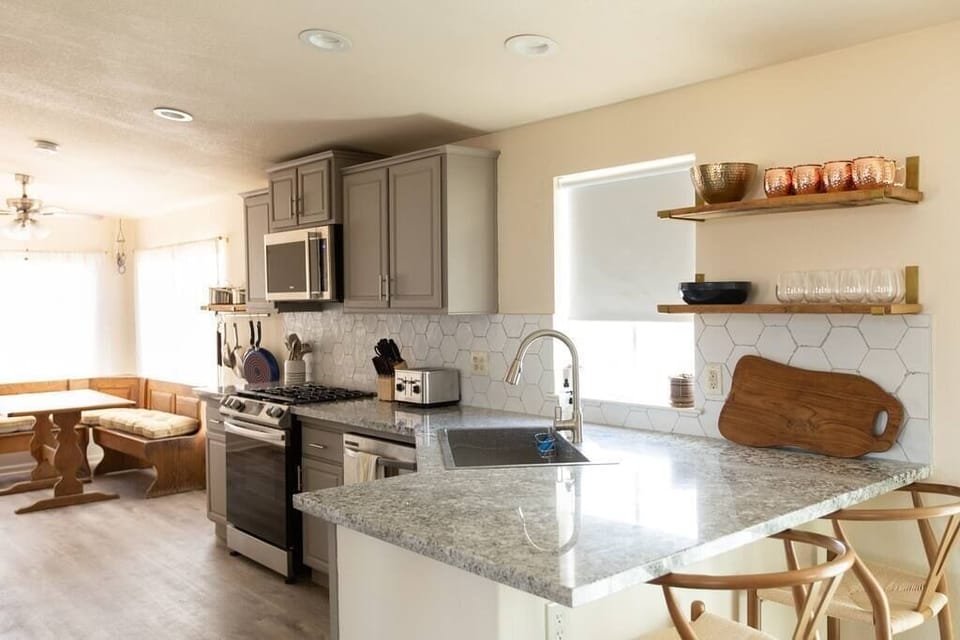 Open concept kitchen area into the breakfast nook. 