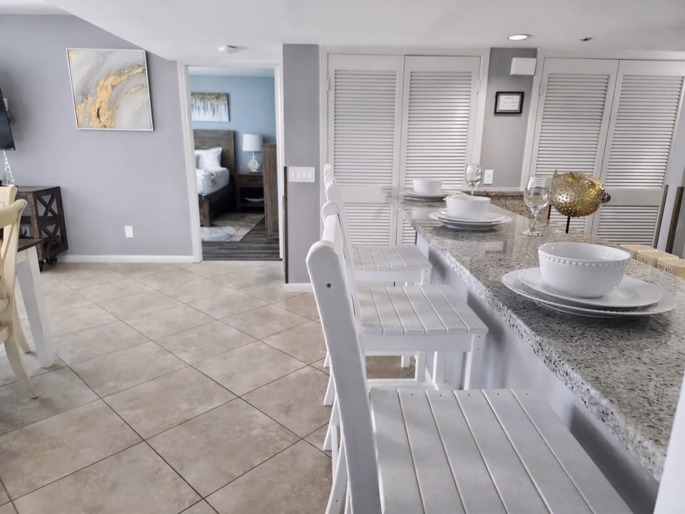 Counter seats with outdoor style seats by the kitchen and dining area