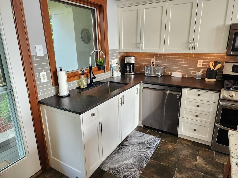 Kitchen is well stocked with a cofee maker, toaster, spices, plates, cups, silverware, etc!