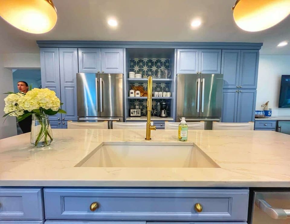 Kitchen sink and 2 refrigerators