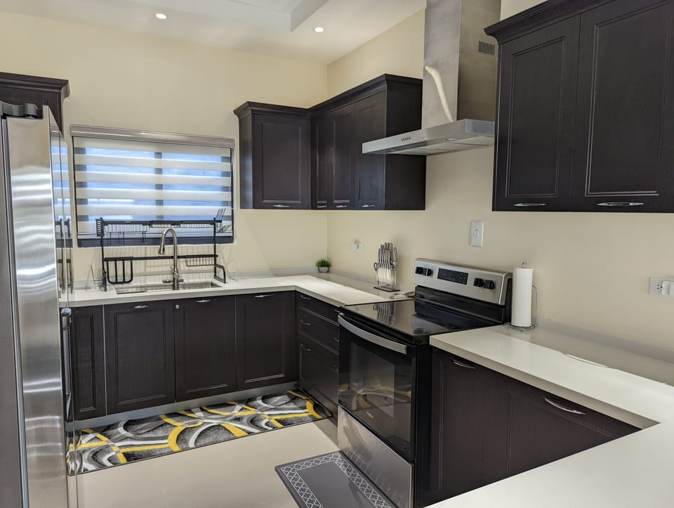 Spacious kitchen is equipped with everything you need. 