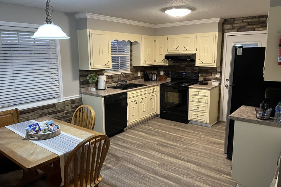 Fully stocked kitchen; additional table seating in family den.
