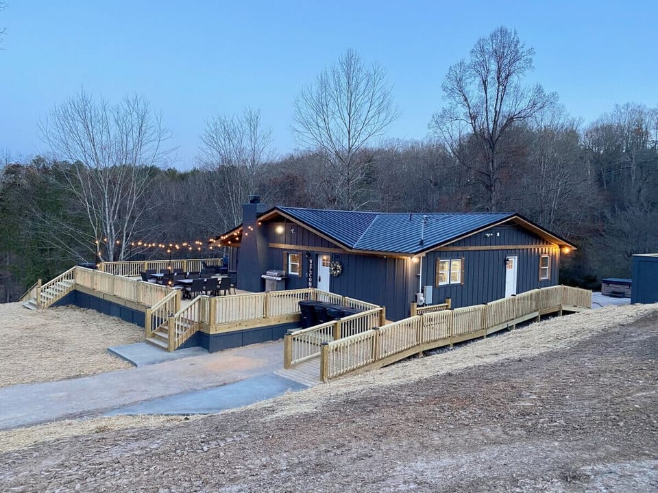 Dusk view of the ramp and pads stretching the full length along the cabin`s rear