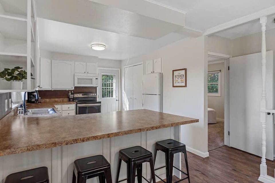 The kitchen is fully equipped, making meal prep easy, while the dining area comfortably seats everyone for memorable meals together.