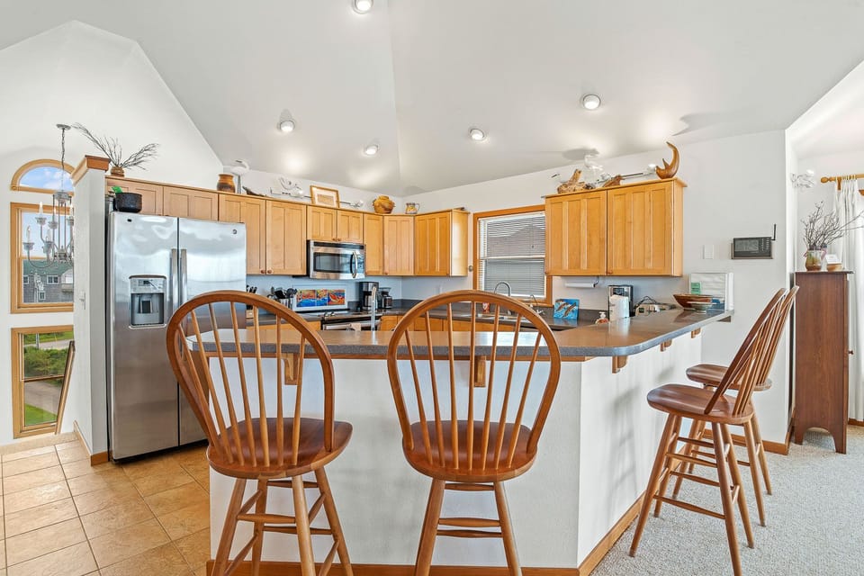 Kitchen with Bar Seating on Third Level