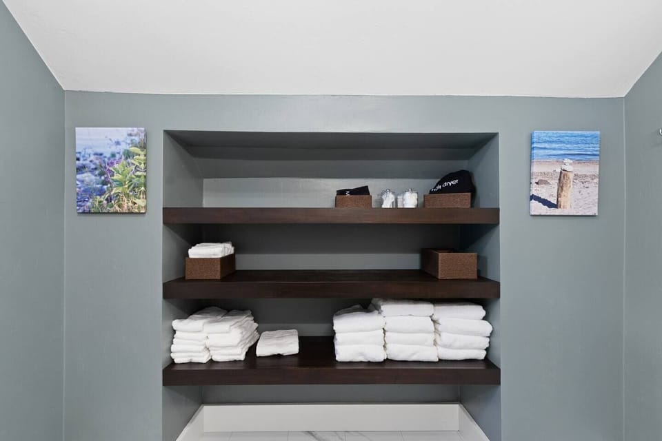 Second floor bathroom with shower over bathtub bathing configuration and oversized vanity