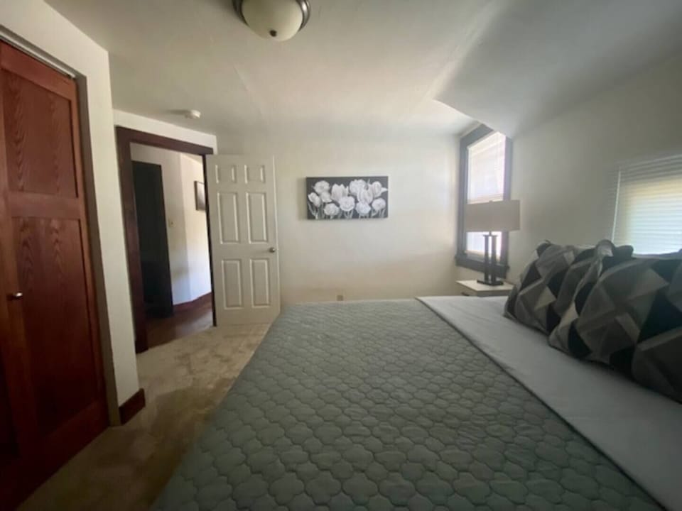 Spacious bedroom with a king sized bed.