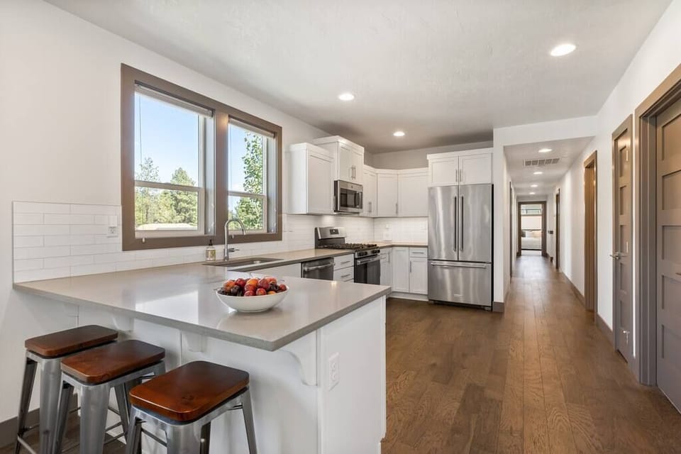 Fully stocked kitchen with barstool seating! 