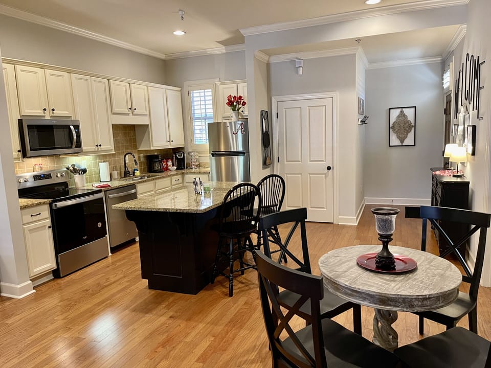 Kitchen and Dining Area - The kitchen is fully equipped with utensils and appliances so you are able to create all sorts snacks and meals.