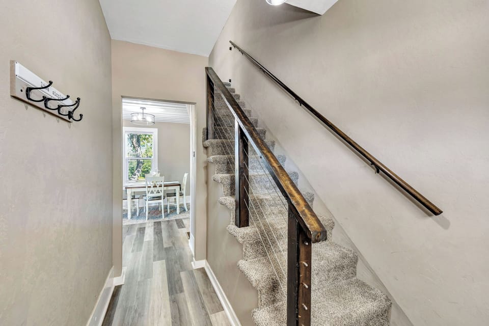 View from the front door & staircase to upstairs bedrooms & bathroom.