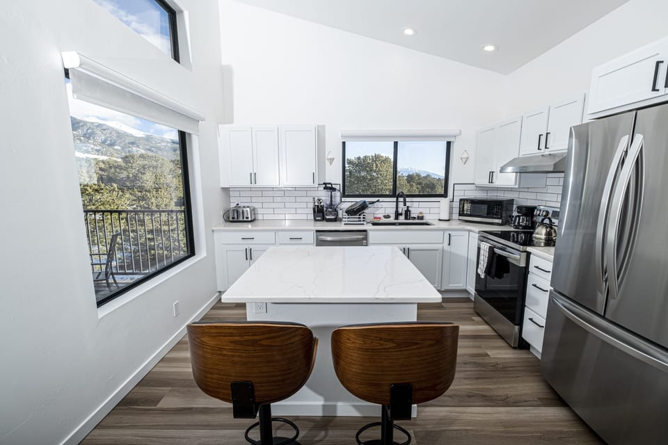 The kitchen island corner is the perfect place to entertain while you cook
