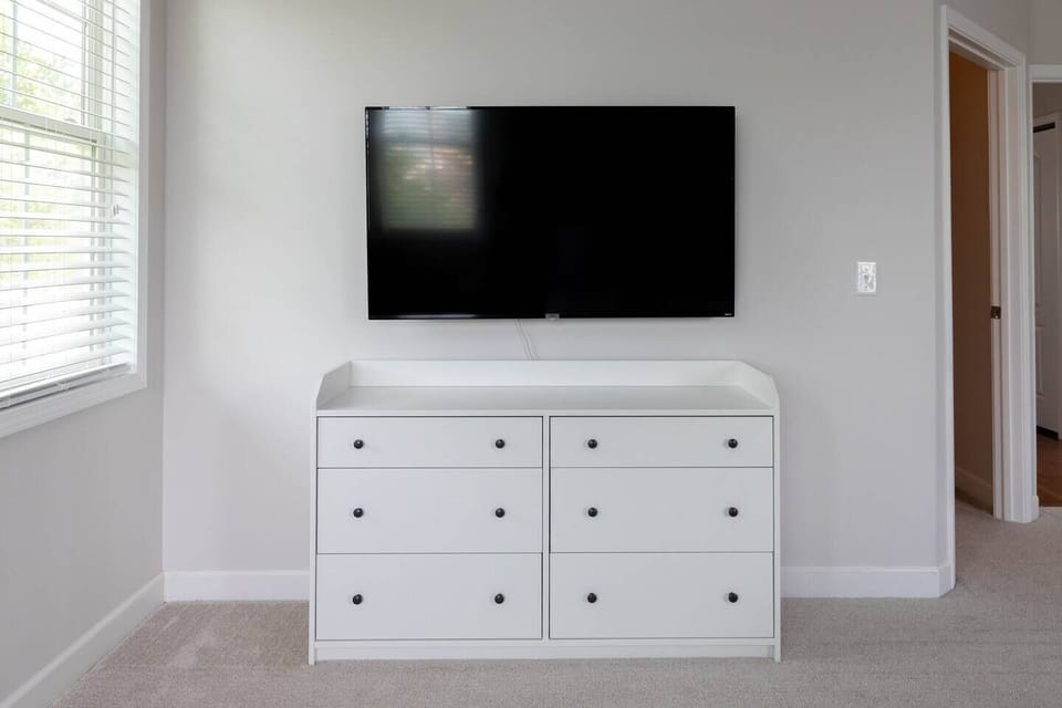 Master bedroom includes 55 inch smart Roku TV 