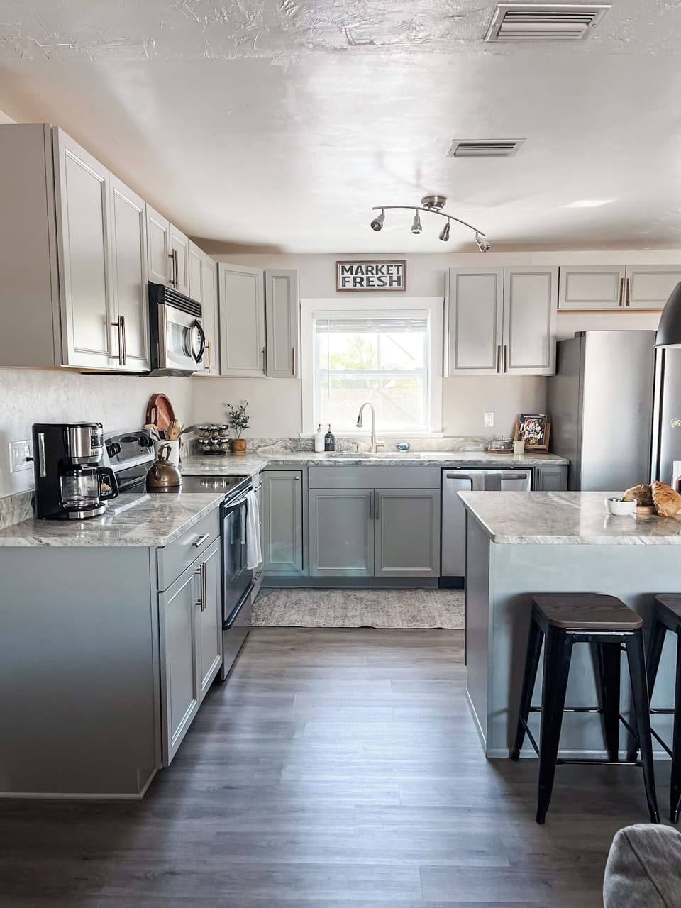 Full size kitchen with an open concept that is perfect for preparing meals together. Plenty of countertop space and modern appliances to get the job done!