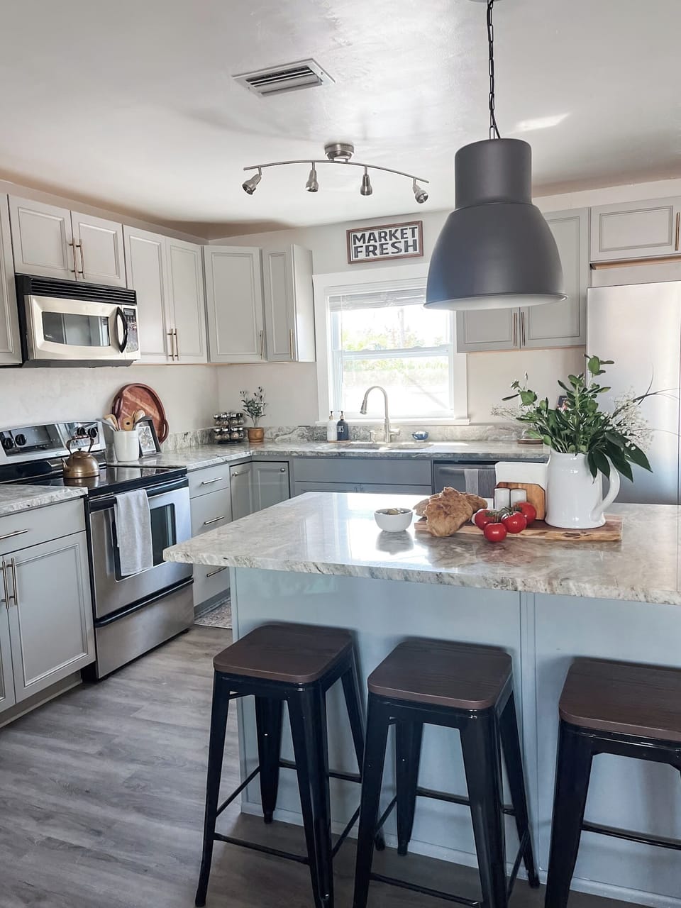 The kitchen island has bar stool seating making it a great place to have a quick breakfast or snack.